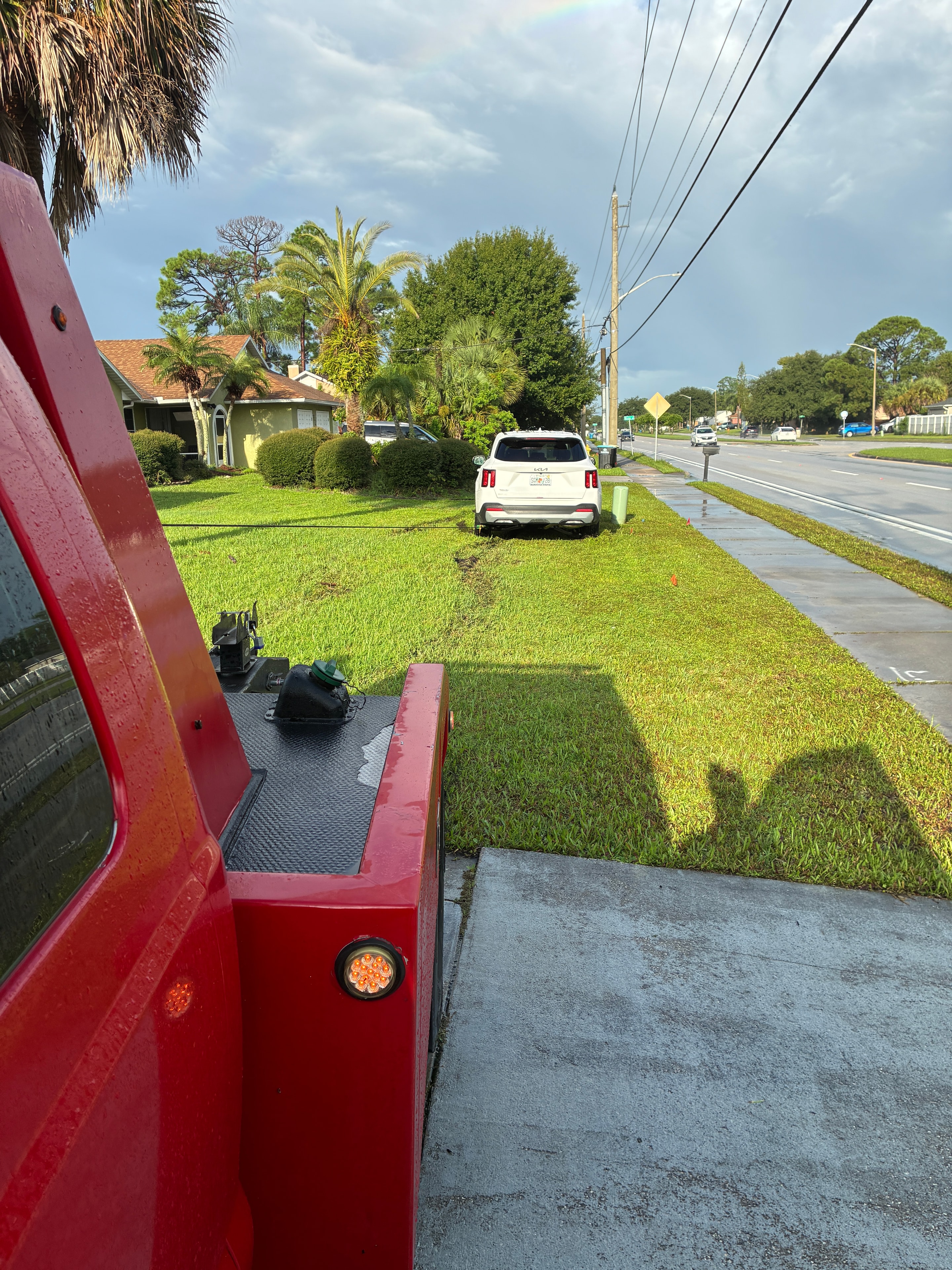 Red truck parked on suburban Florida street