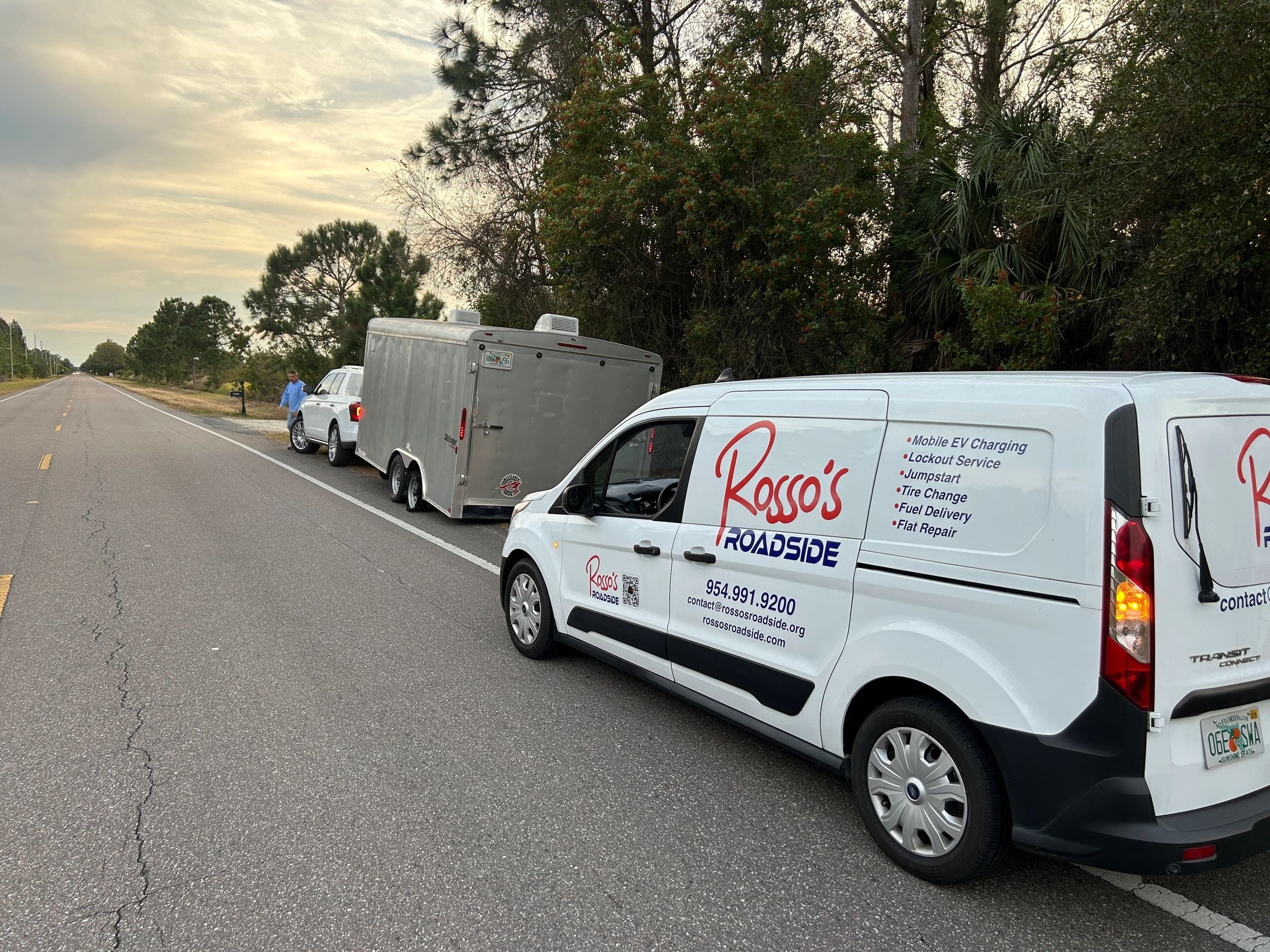 Rosso's Roadside tow truck towing an SUV
